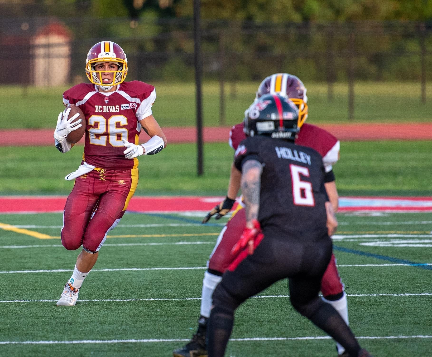 Protagonist apparel clothing founder running the ball in football game