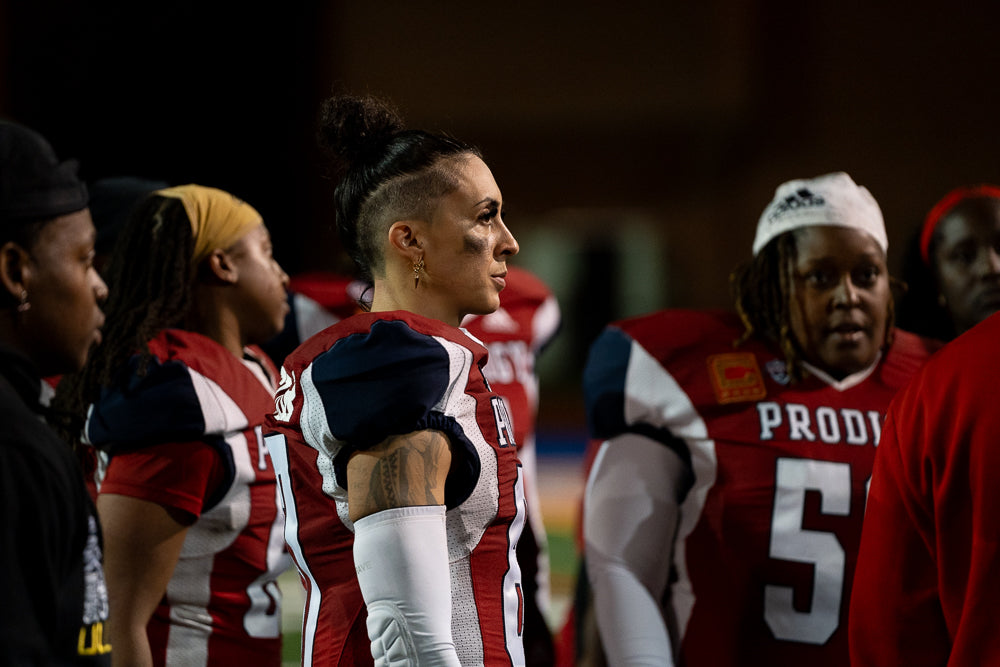 Protagonist apparel clothing founder in a football huddle